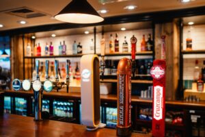 Bar and draught beer selection in a Marston's Grandstand pub