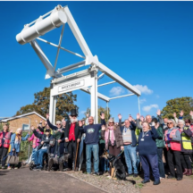 Volunteers celebrate beneath Buck's Bridge at Gallows Reach in Lichfield