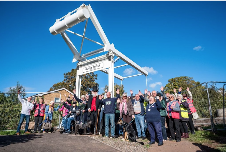 Volunteers celebrate beneath Buck's Bridge at Gallows Reach in Lichfield